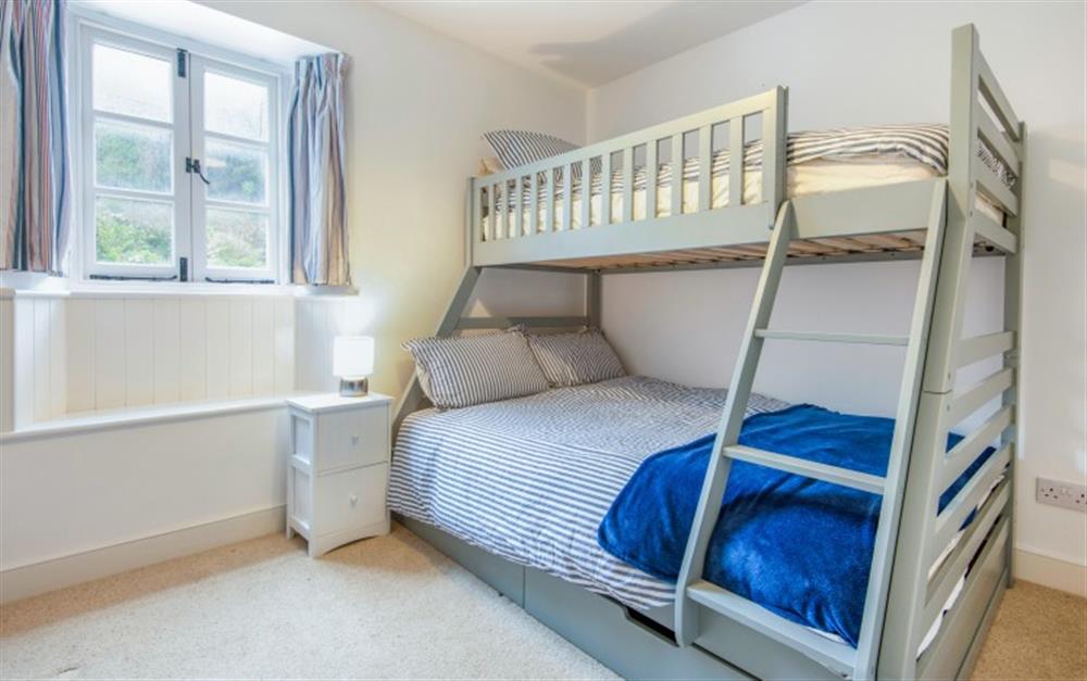 Bedroom 2 with solid bunks, at Anchor Cottage in Beesands