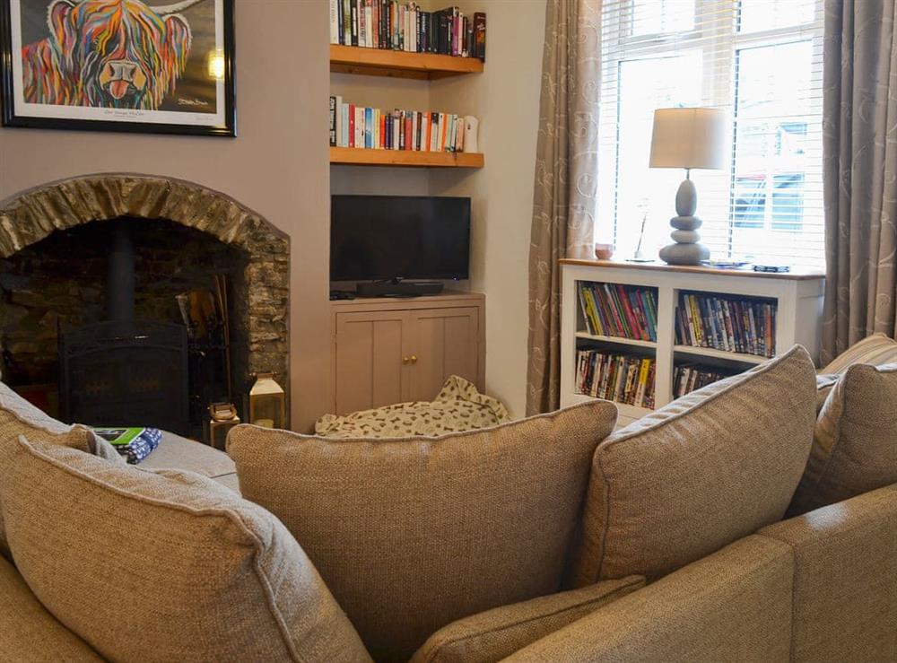 Cosy living area with wood burner at Anchor Cottage in Instow, near Bideford, Devon