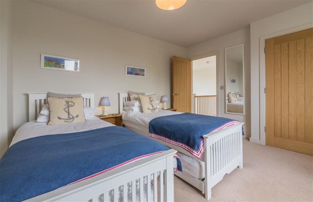 First floor: Bedroom two with full-size twin beds at Anchorage, Brancaster near Kings Lynn