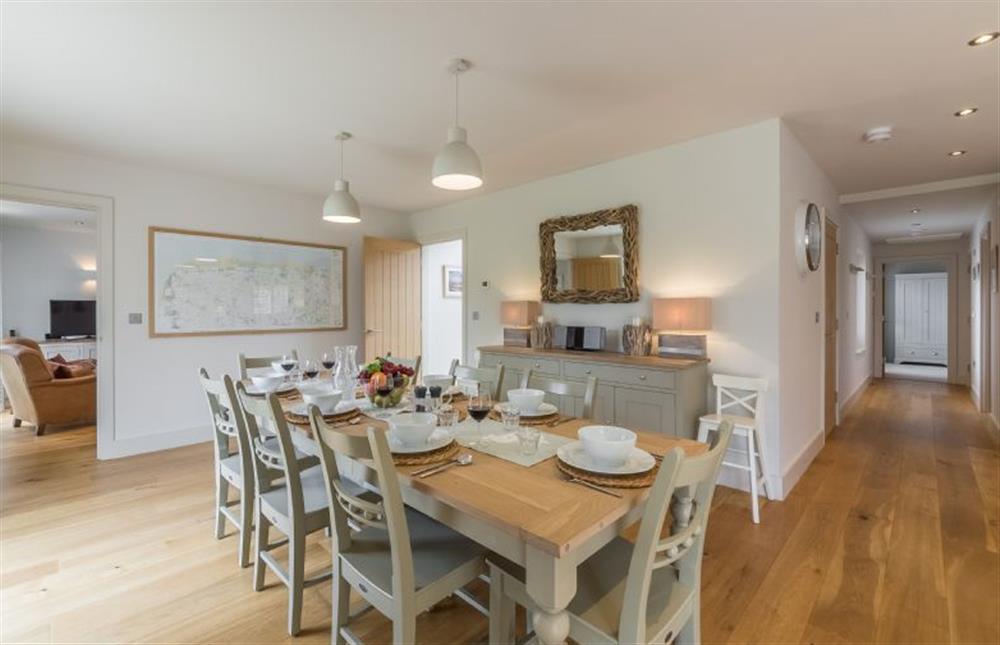 Ground floor: Dining area with table and seating for eight at Anchorage, Brancaster near Kings Lynn
