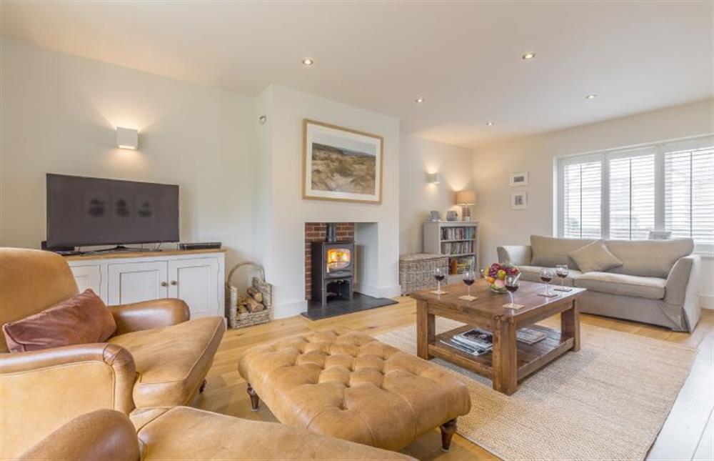 Ground floor: Sitting room with wood burning stove at Anchorage, Brancaster near Kings Lynn