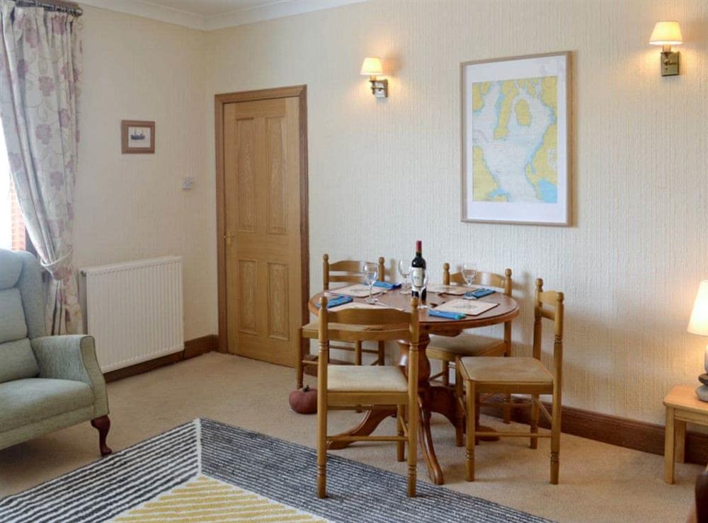 Convenient dining area within living room at Anchorage in Maidens, Ayrshire