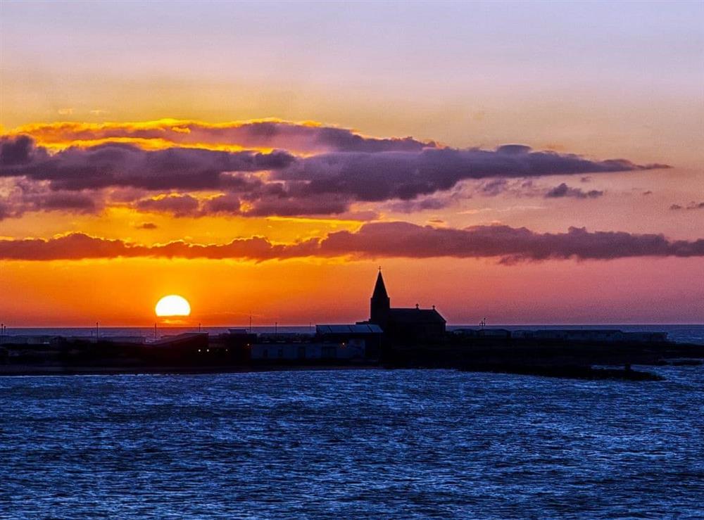 Sunrise over the bay at Anchors Point in Newbiggin-by-the-Sea, Northumberland