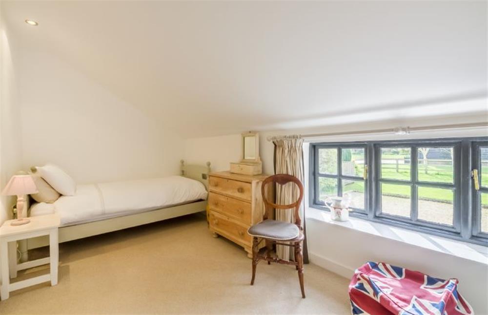 First floor: Bedroom three, family bedroom with double and single bed at Angel Cottage, Great Walsingham