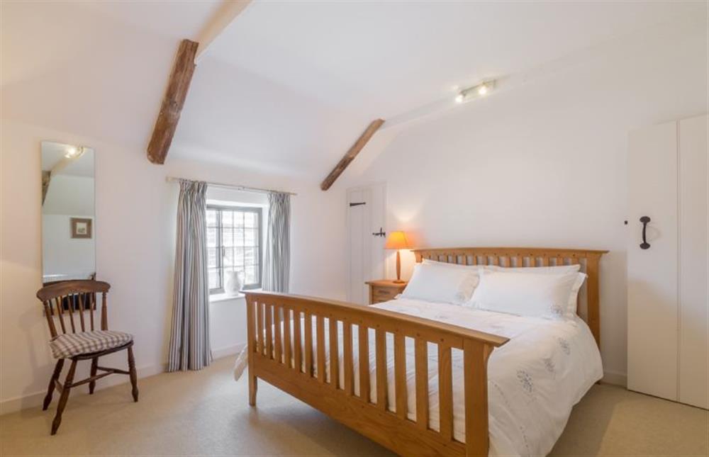 First floor: Bedroom two, king-size bed at Angel Cottage, Great Walsingham
