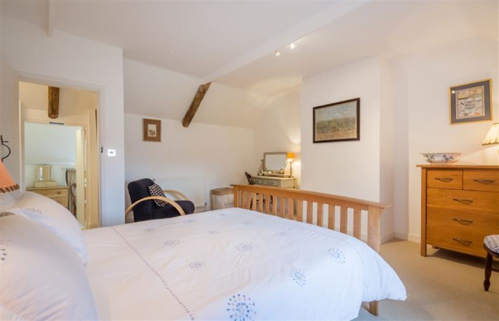 First floor: Bedroom two, with king-size bed (photo 2) at Angel Cottage, Great Walsingham