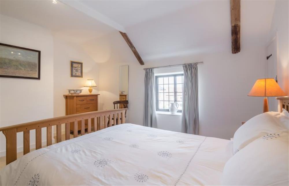 First floor: Bedroom two, with king-size bed at Angel Cottage, Great Walsingham