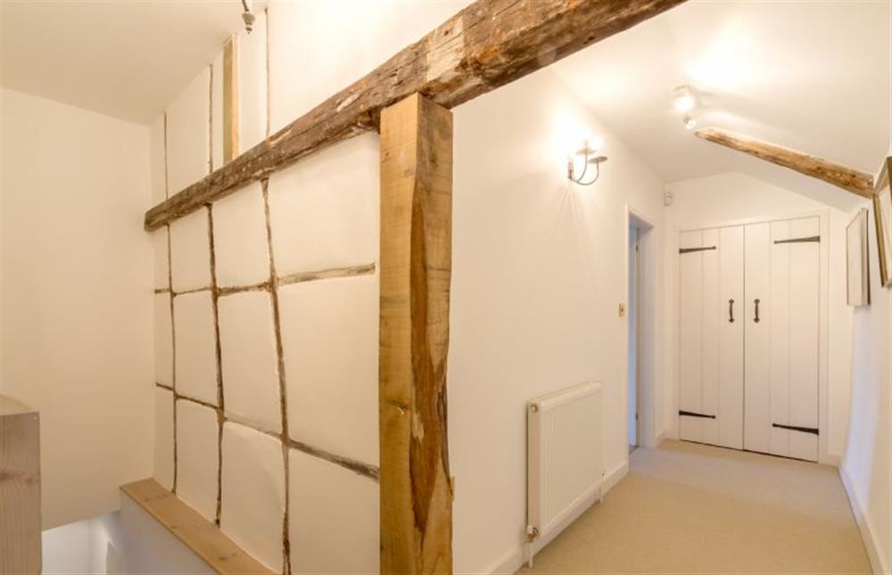 First floor: Landing with exposed beams at Angel Cottage, Great Walsingham