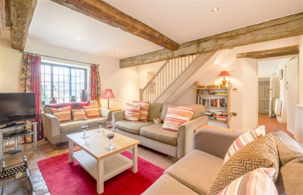 Ground floor: Sitting room with stairs to first floor at Angel Cottage, Great Walsingham