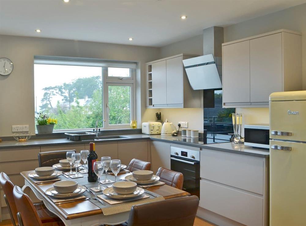 Ultra-modern fitted kitchen/dining area at Angle Tarn Cottage in Ambleside, North Yorkshire