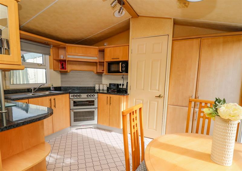 This is the kitchen at Animal Sanctuary Caravan Stay, Tegryn near Crymych