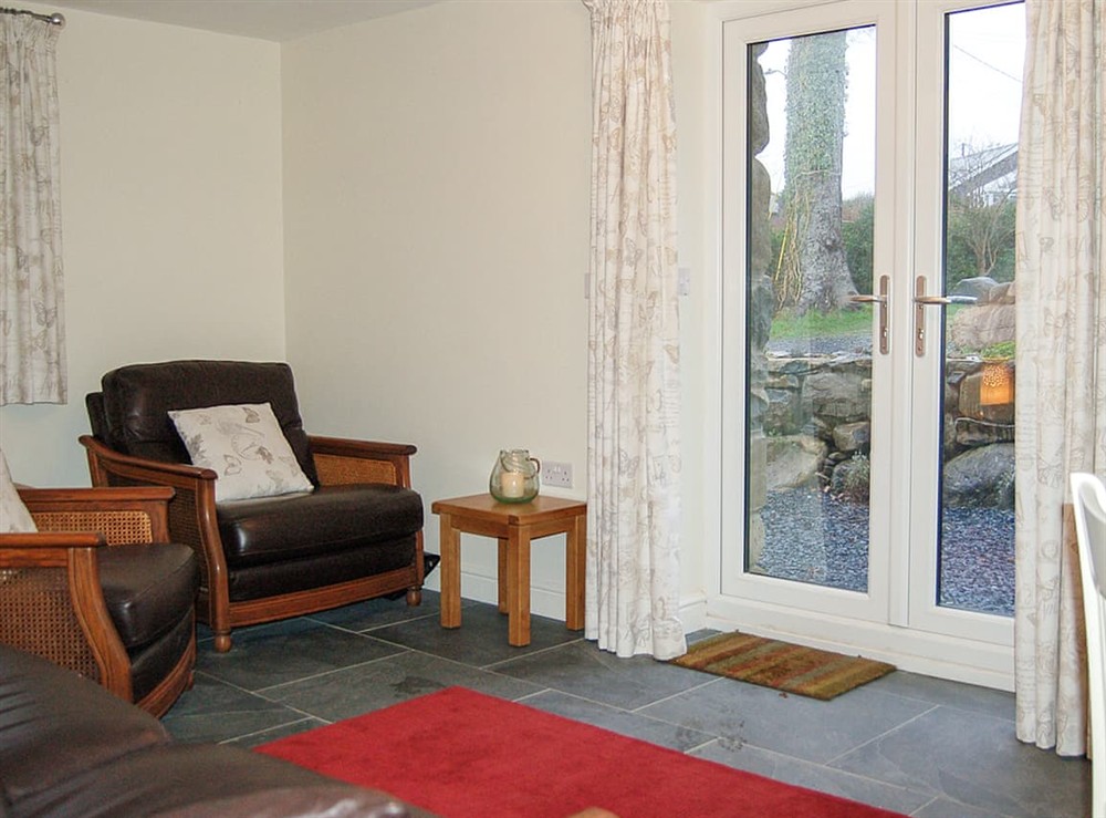 Living room at Anneddle Talybont Cottage in Tal Y Bont, Gwynedd