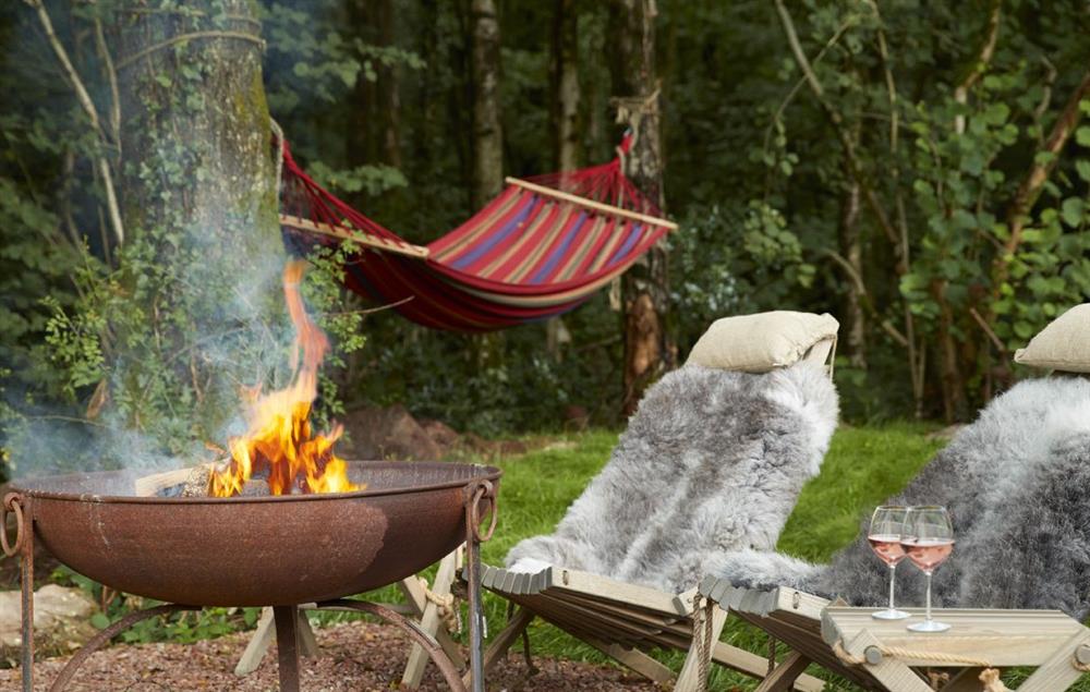 Relax by the fire pit in the evenings at Annes Hut, Penterry