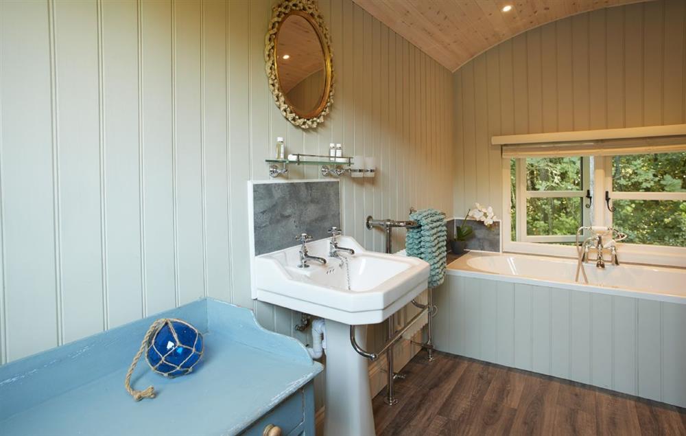The bathing and dressing hut with double ended bath and walk in shower  (photo 2) at Annes Hut, Penterry