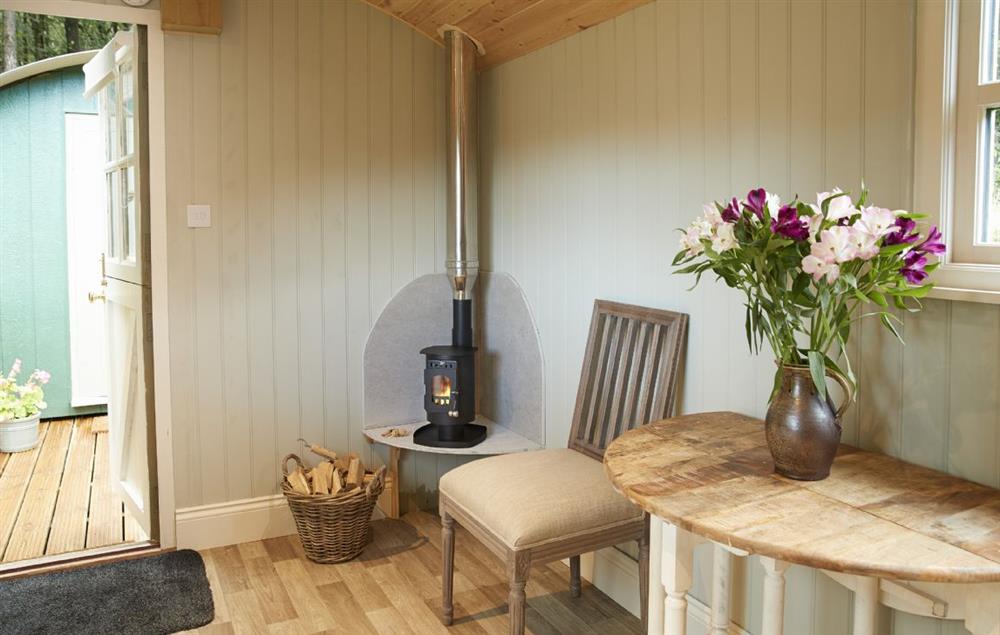 The main shepherd’s hut with compact yet effective wood burning stove at Annes Hut, Penterry