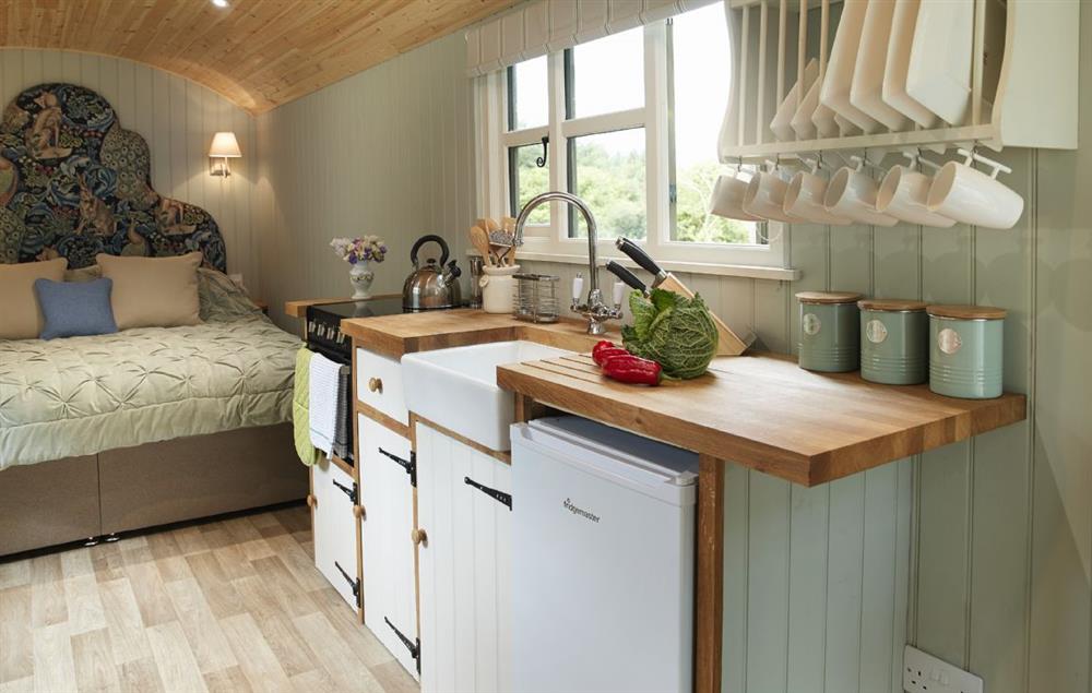 The main shepherd’s hut with super king bed, well appointed kitchen and dining area (photo 2) at Annes Hut, Penterry