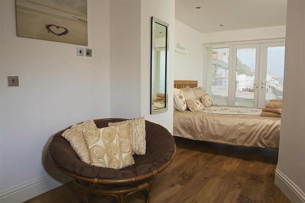 Master bedroom with doors out to the terrace at Apartment 1, At The Beach in Torcross, Nr Kingsbridge