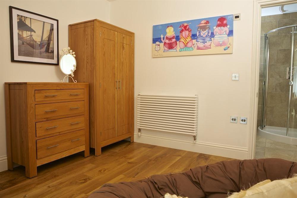 Master bedroom with en suite bathroom at Apartment 1, At The Beach in Torcross, Nr Kingsbridge