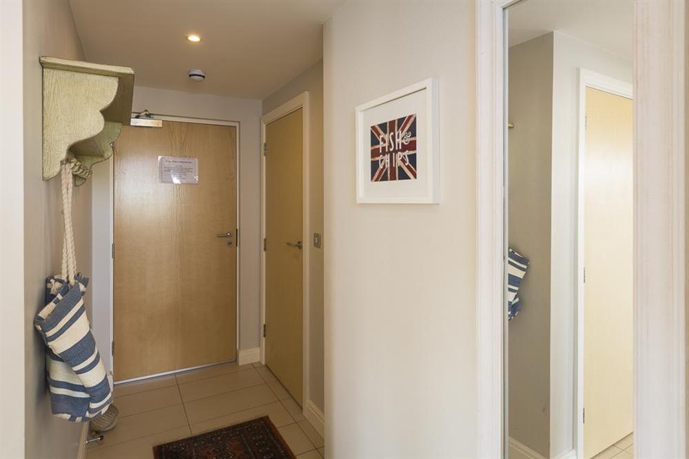 Cupboard in hallway houses a washer/dryer at Apartment 1, Oceans Edge in Thurlestone Sands, Nr Kingsbridge