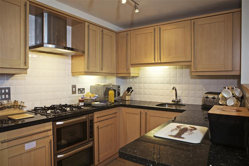 Modern kitchen with granite worktops at Apartment 13 Combehaven in Allenheyes Road, Salcombe