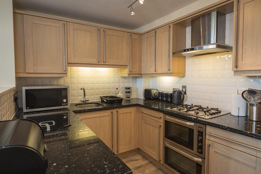 New England 'shaker' style maple kitchen with granite worktop at Apartment 14, Combehaven in Allenhayes Road, Salcombe