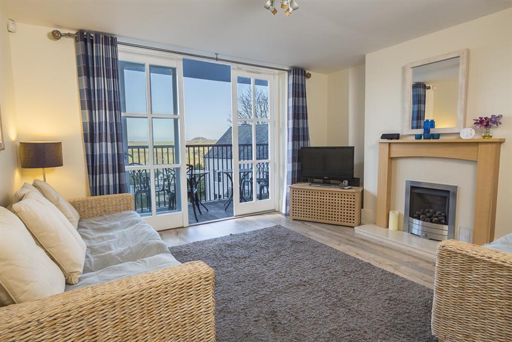Spacious, open plan living room leading to double French doors that open out to a balcony, boasting stunning views at Apartment 14, Combehaven in Allenhayes Road, Salcombe