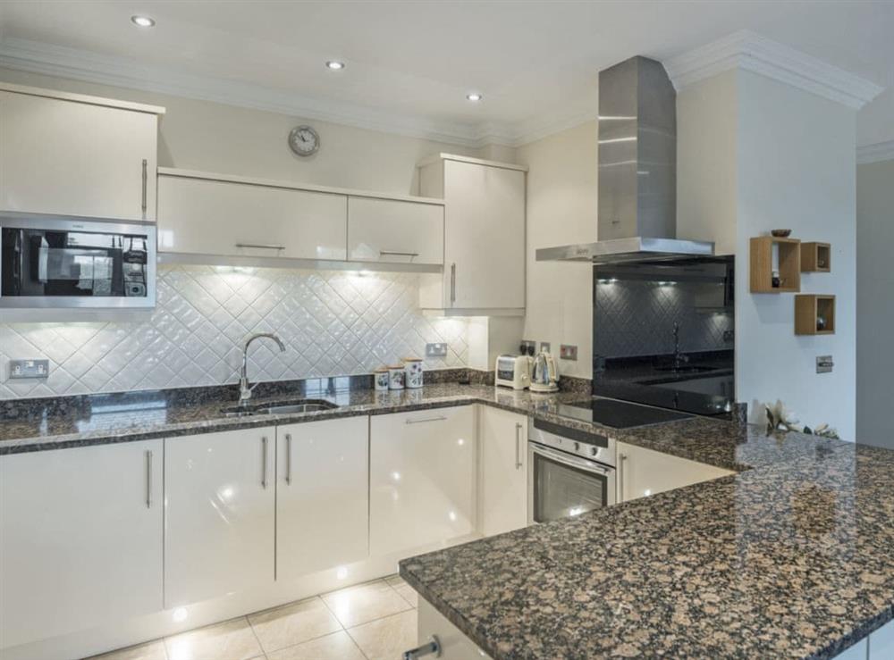 Contemporary kitchen area at Apartment 14, Hazelwood Hall in Silverdale, near Carnforth, Lancashire