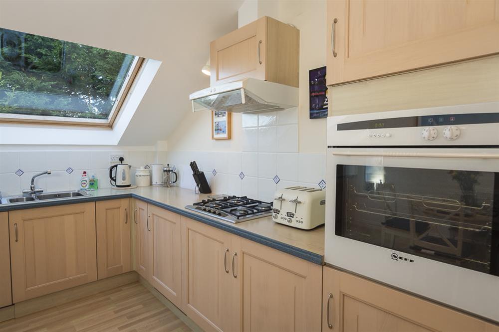 Kitchen area which is light and sunny with large velux windows and stripped pine flooring at Apartment 19, Bolt Head in South Sands, Salcombe