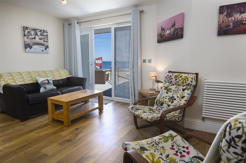 Comfortable lounge area with French doors out to the terrace at Apartment 2, At The Beach in Torcross, Nr Kingsbridge