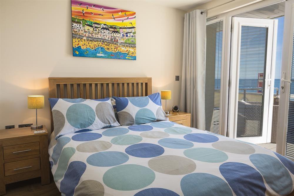 Master bedroom with en suite shower room at Apartment 2, At The Beach in Torcross, Nr Kingsbridge