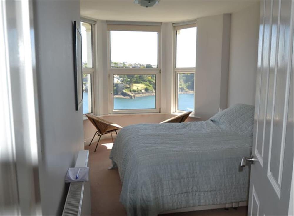 Modest king size bedroom with furniture at Apartment 2 The Wheelhouse in Fowey, Cornwall