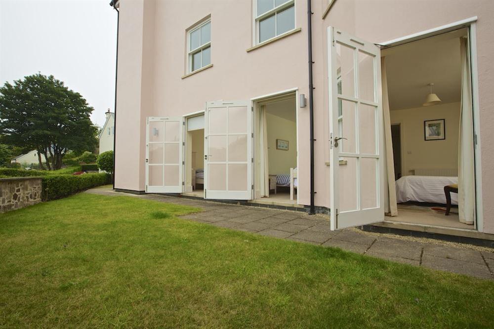 All three bedrooms have French doors out to paved terrace and garden at Apartment 3 Combehaven in Allenhayes Road, Salcombe