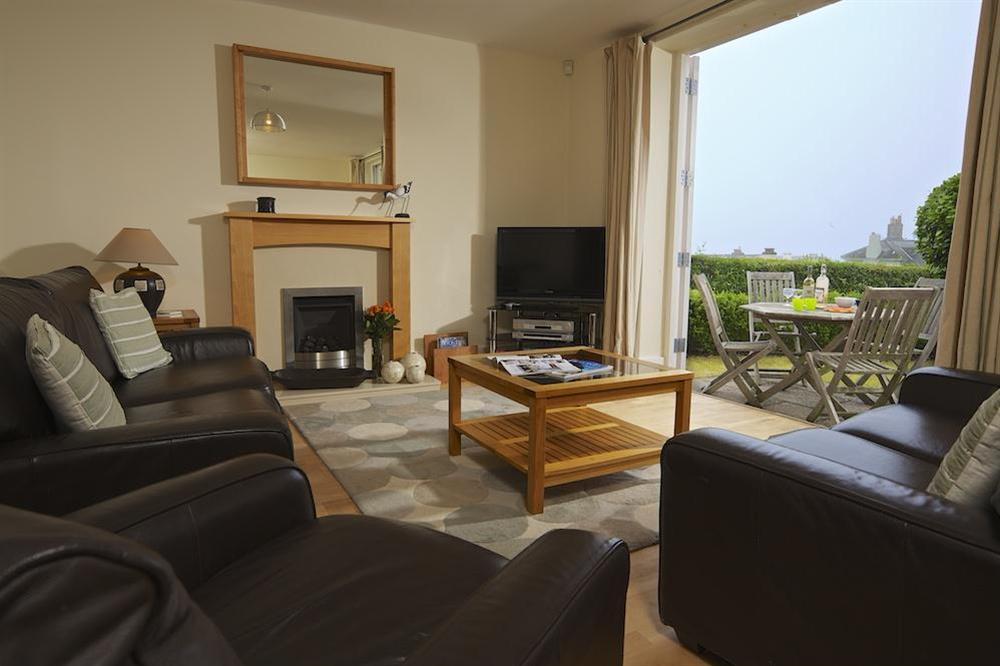 Lounge with double doors opening onto the terrace at Apartment 3 Combehaven in Allenhayes Road, Salcombe