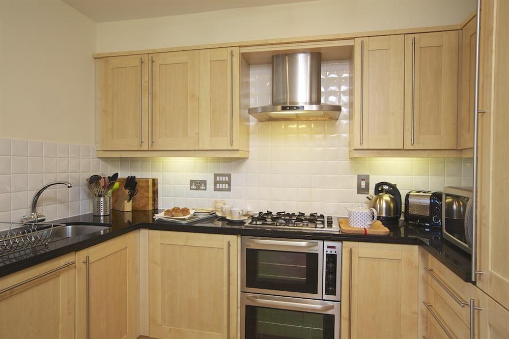 New England 'shaker' style maple kitchen at Apartment 3 Combehaven in Allenhayes Road, Salcombe