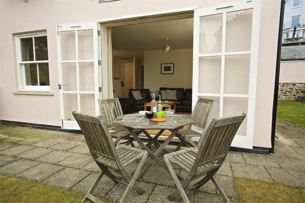 Small south facing front garden and terrace with table and chairs at Apartment 3 Combehaven in Allenhayes Road, Salcombe