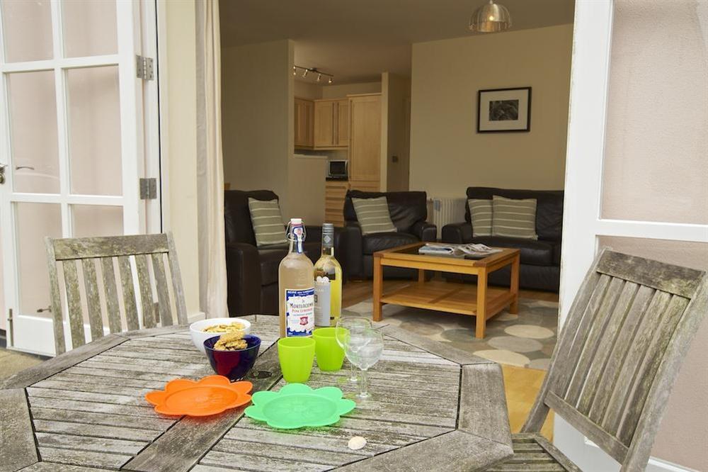 Terrace with table and chairs at Apartment 3 Combehaven in Allenhayes Road, Salcombe