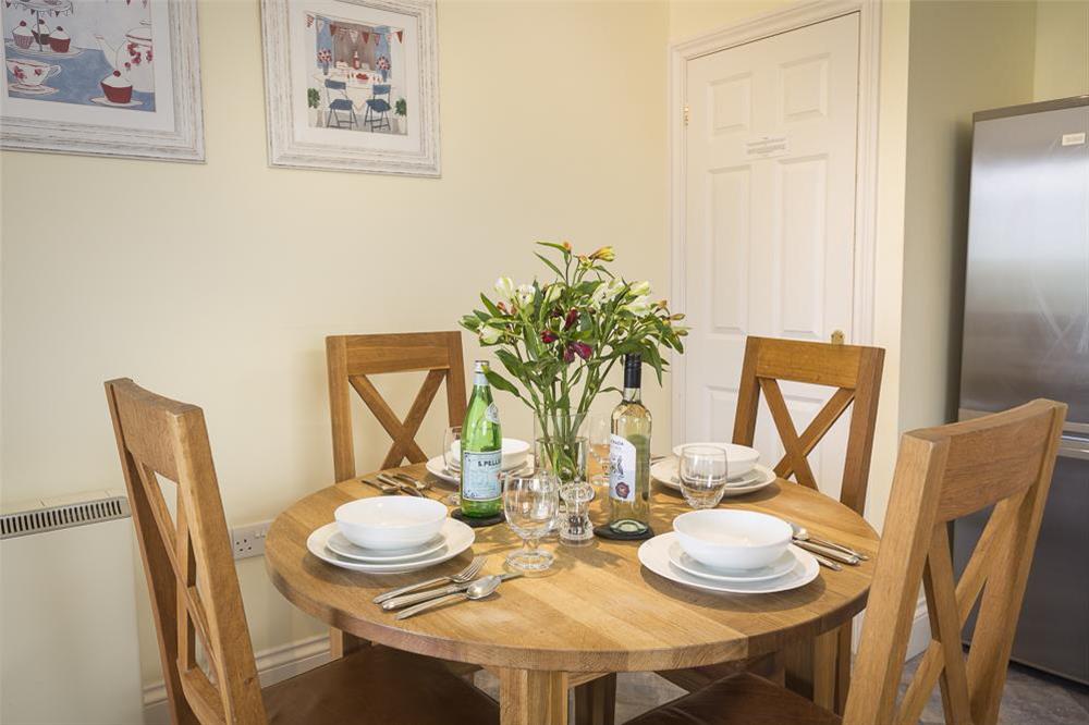 Dining area with oak table and chairs at Apartment 4 Lyndhurst in Bonaventure Road, Salcombe