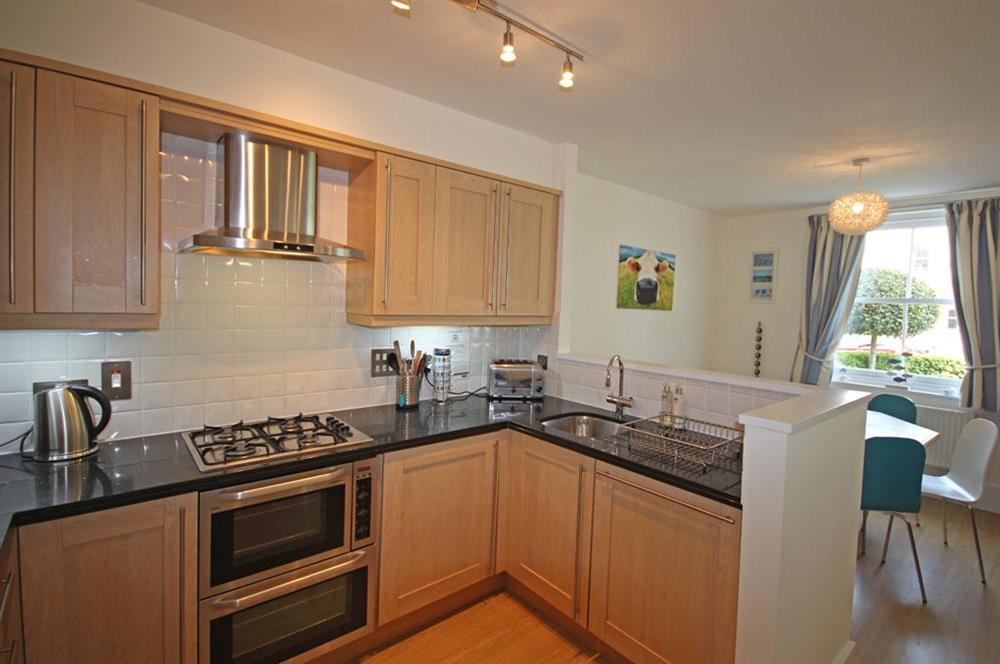 Open-plan area with New England 'shaker' style maple kitchen at Apartment 5 Combehaven in Allenhayes Road, Salcombe