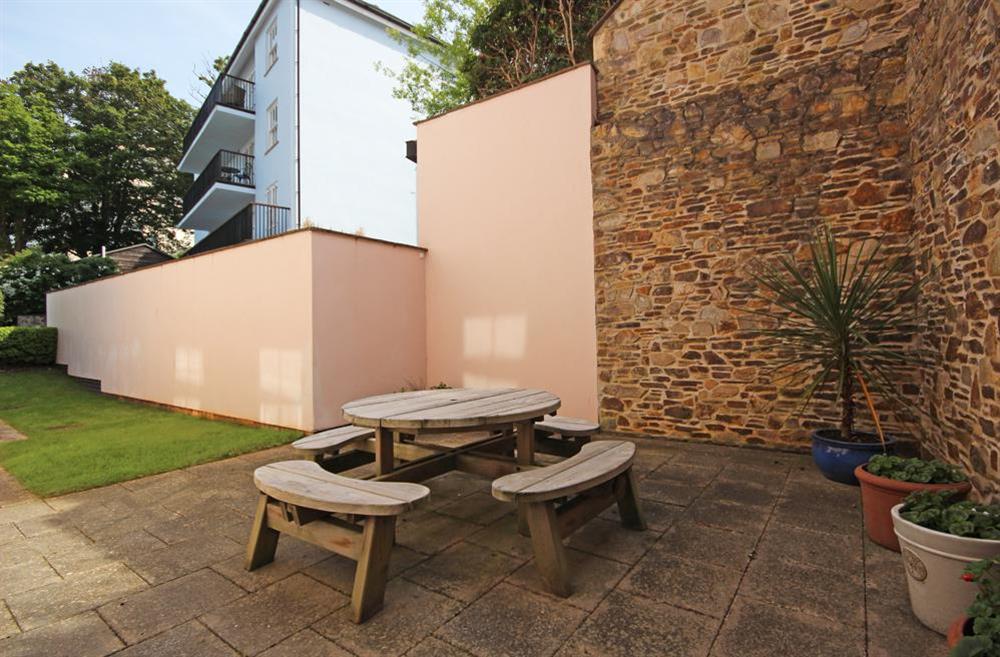 Paved side terrace accessed from all three bedrooms (photo 2) at Apartment 5 Combehaven in Allenhayes Road, Salcombe