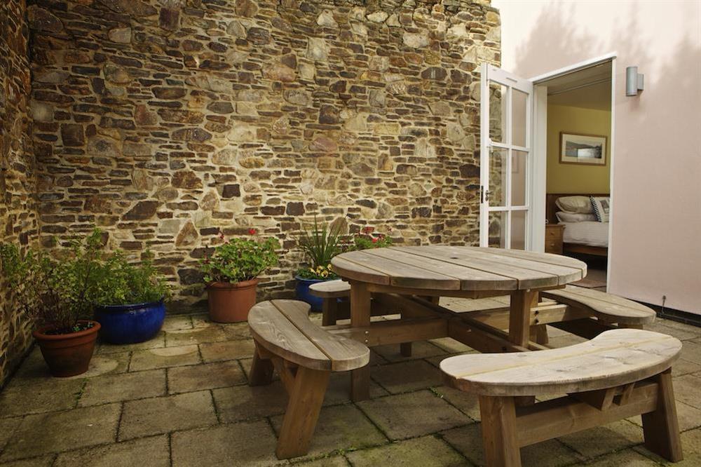 Paved side terrace accessed from all three bedrooms at Apartment 5 Combehaven in Allenhayes Road, Salcombe
