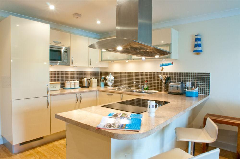 Beautifully designed kitchen area with breakfast bar at Apartment 6  Bolt Head in , Salcombe
