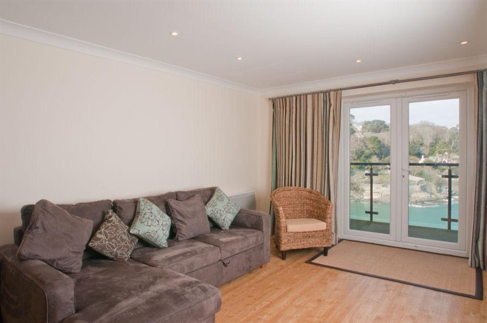Sitting room with large sofa and French doors to balcony at Apartment 6  Bolt Head in , Salcombe