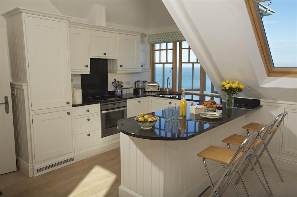 Light and sunny kitchen with breakfast bar and three stools at Apartment 9, Prospect House in South Hallsands, Kingsbridge