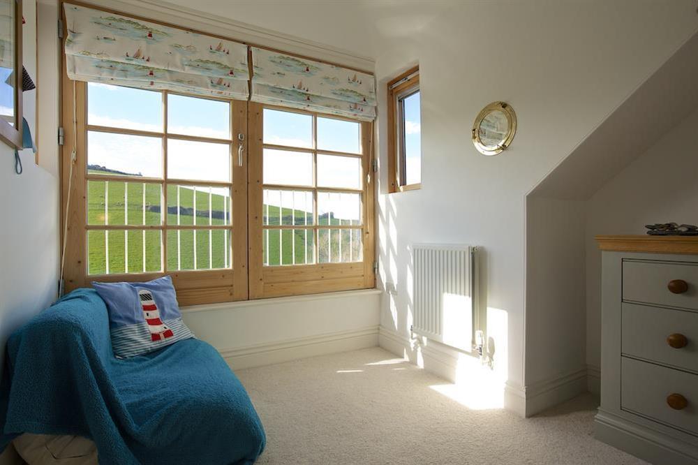 Single bedroom with Juliet balcony overlooking the neighbouring farmland at Apartment 9, Prospect House in South Hallsands, Kingsbridge