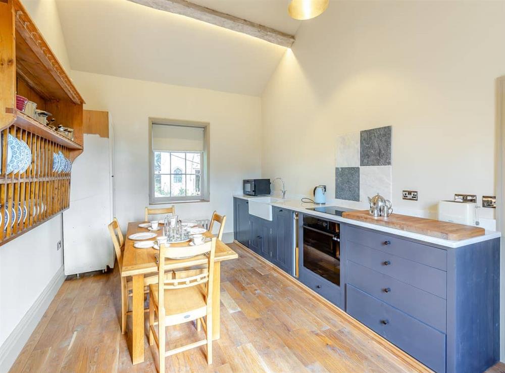 Kitchen/diner at Apartment at Llanerchydol Hall in Welshpool, Powys