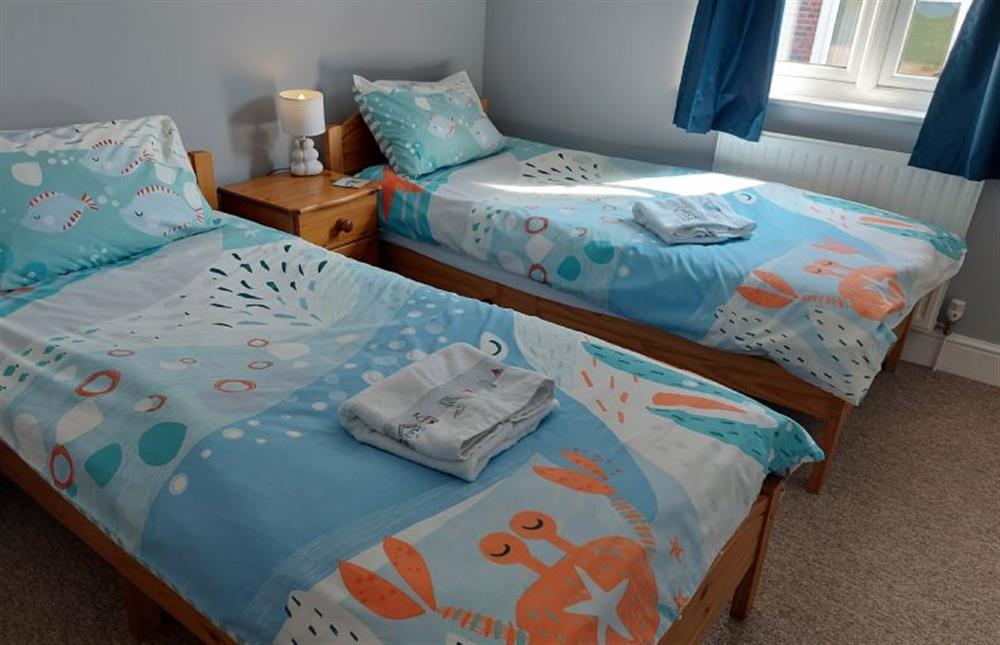 Bedroom two with twin 3ft beds at Apartment Eight by the Sea, Sheringham