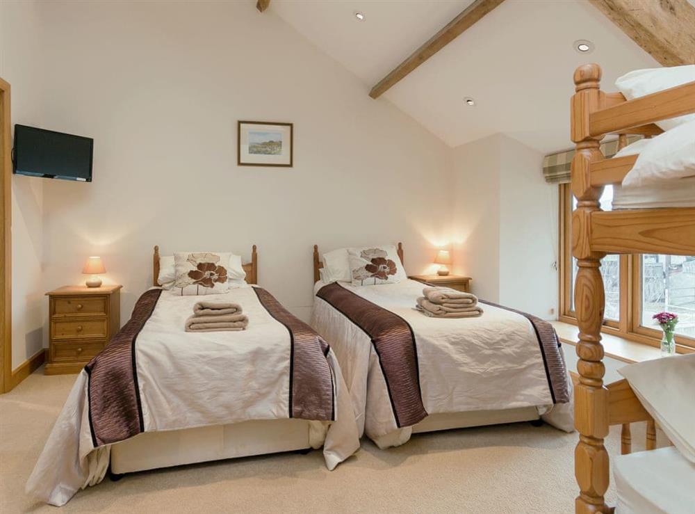 Bedroom with twin and bunk beds at Apple Barn in West Pennard, near Glastonbury, Somerset