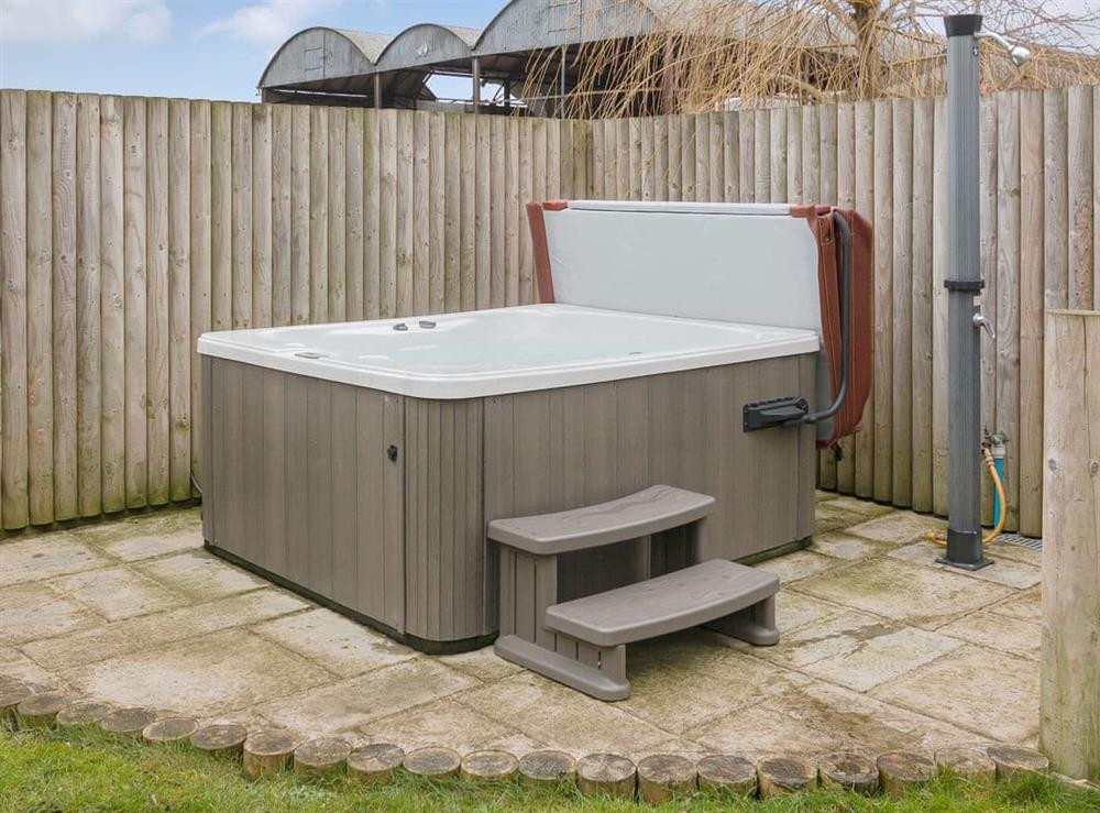 Relaxing hot tub at Apple Barn in West Pennard, near Glastonbury, Somerset