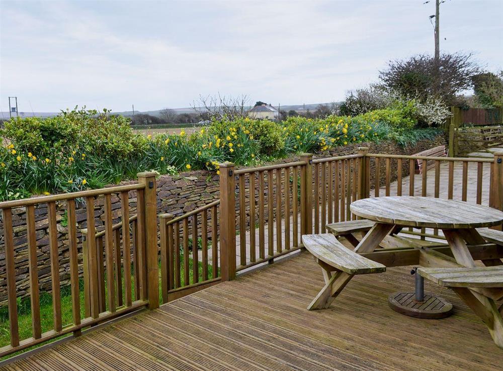 Decking with patio bench at Apple Blossom Cottage in St Ervan, near Padstow, Cornwall