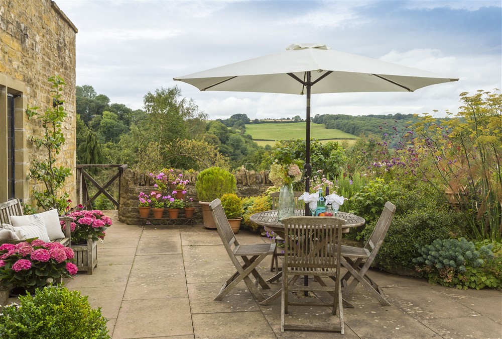 The idyllic terrace with enviable views at Apple Cottage, Snowshill
